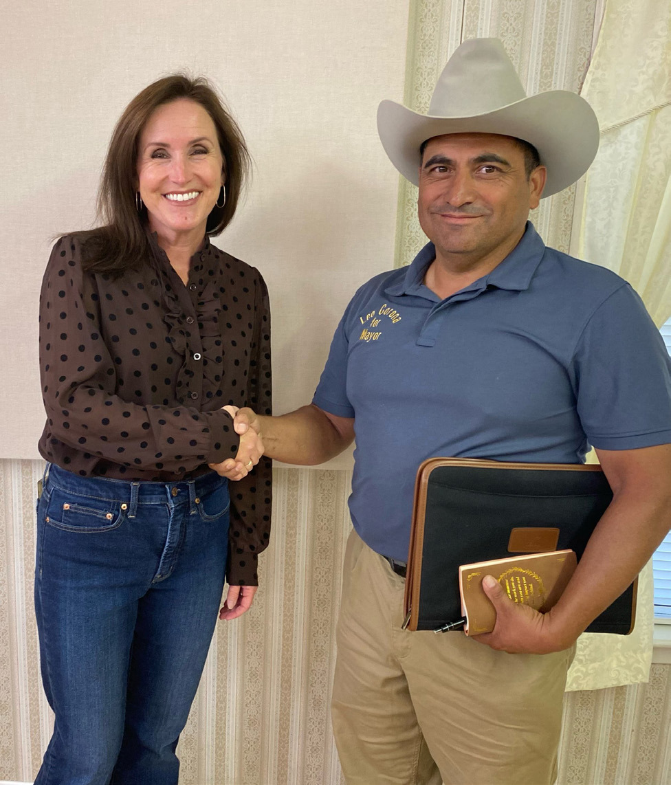 Gatesville’s mayoral candidates Meredith Rainer and Leo Corona shake hands before speaking to the members of Gamma Alpha. The Gatesville Messenger | David Scott