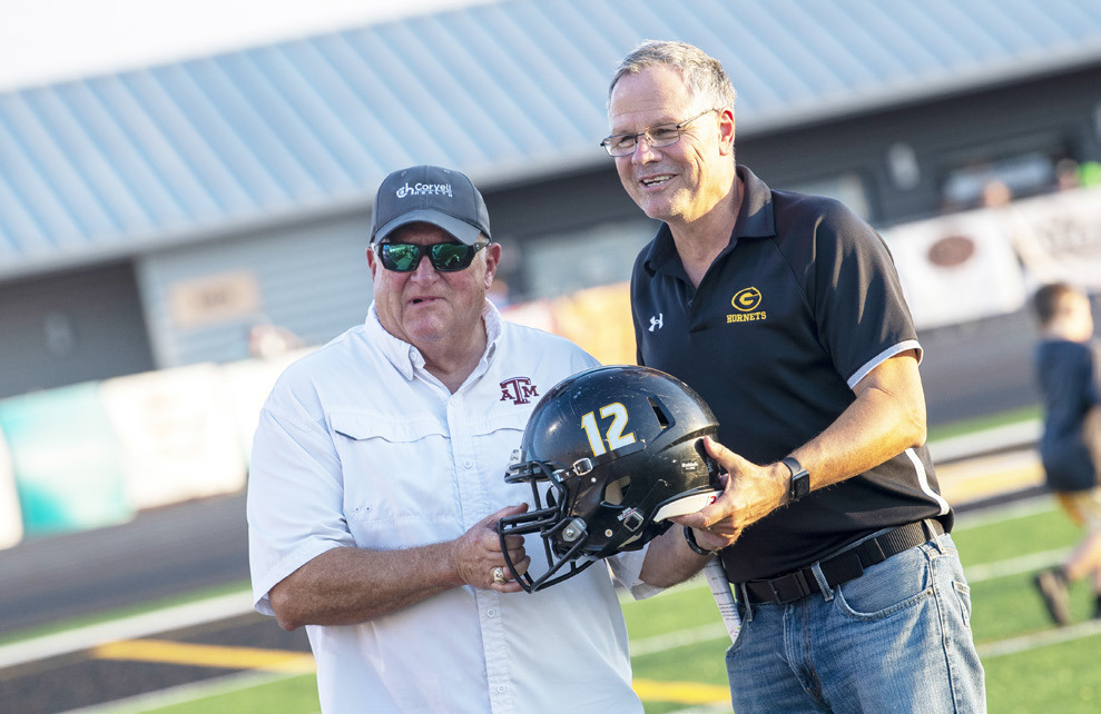 Gatesville ISD Athletic Director Rickey Phillips and Coryell Health CEO David Byrom display a helmet prior to kickoff of the home opener. GATESVILLE MESSENER/David Morris