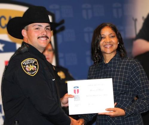 William R. Massey, Gatesville Police Department, receives his Police Academy Basic Peace Officer Course graduation certificate from Central Texas College Chancellor Dr. Michele J. Carter during the Alpha Class of 2026 graduation ceremony.