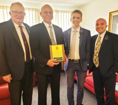 Courtesy photo John Flournoy, Pastor of the Church of Latter-Day Saints in Gatesville, shows off his Military Order of World Wars Plaque with Wendell Jones (left) and the local LDS Missionaries (right). Fluornoy received the award from Retired LTC James Marques from NFH Chapter. The award is given to those in the community who have done outstanding service to the people of Gatesville.