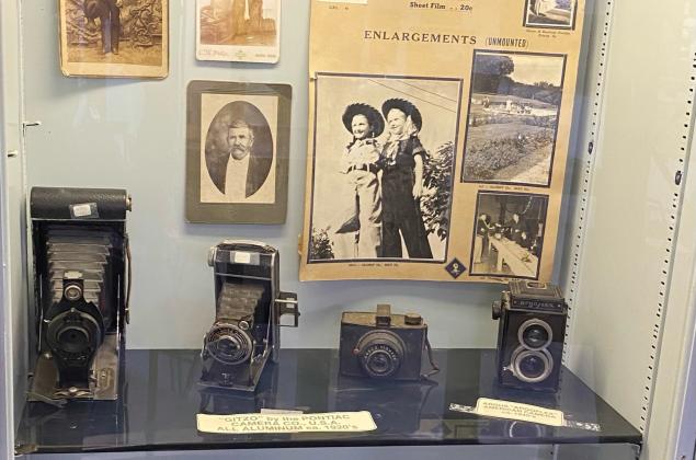 Display cases that show early day cameras and photographs from Coryell County.