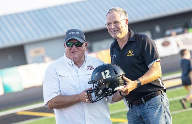 Gatesville ISD Athletic Director Rickey Phillips and Coryell Health CEO David Byrom display a helmet prior to kickoff of the home opener. GATESVILLE MESSENER/David Morris