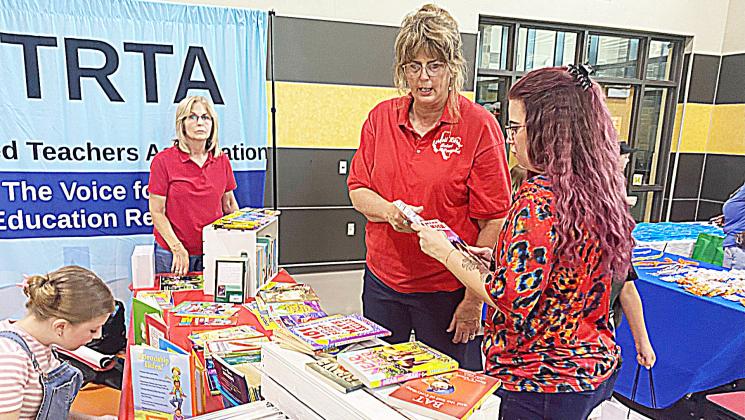 Members of the Retired Teachers Association had a booth at the recent Back to School Bash where they handed out free books to students and parents. They had several students interested in the books they were providing. The Gatesville Messenger/ David Scott