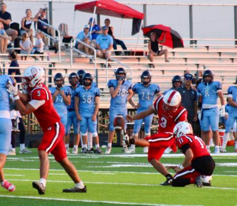 Javon Howard kicks the ball throguh the uprights during a point after touchdown attempt for the Tigers. COURTESY PHOTO