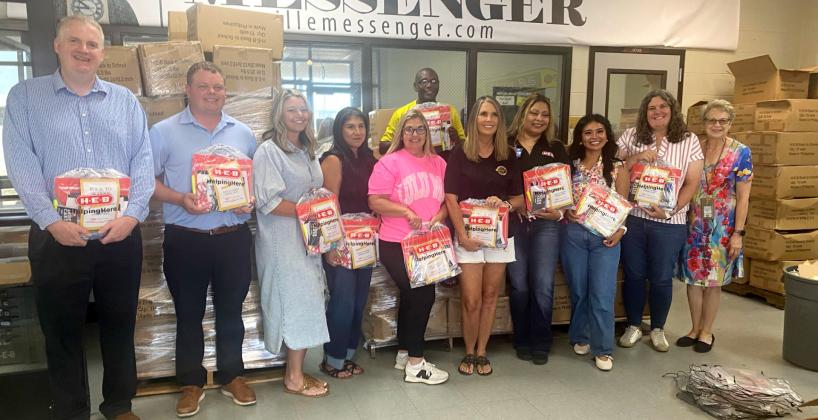 Pictured left to right are GISD employees, Gatesville Education foundation members, and H-E-B representatives: GISD superintendent, Dr. Barrett Pollard, Dan Davidson, Brittany Ellison, Velda Watson, Susie Meelbusch, Julie Matthews, HEB employees Teresa Moya and Micaela Klaich, Amanda Aguirre, and Michelle Martin. Gatesville Messenger/David Scott