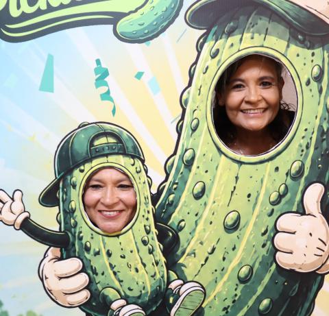 Local women take advantage of the pickle cardboard cutout photo opportunity during the first ever Pickle Festival on Friday, July 3. GATESVILE MESSENGER/ Ally Hinkle