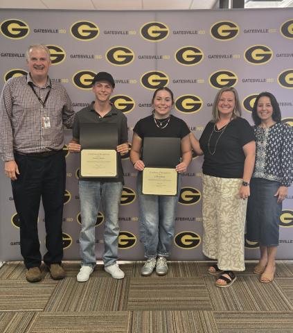 From left to right: Superintendent Dr. Barrett Pollard, students Jadan Moore and Lilly Kinsey, high school choir director Cherith Wells and high school principal Liz Shoaf pose during the student spotlight portion of the Monday, Aug. 17, school board meeting. Ally Hinkle I The Gatesville Messenger