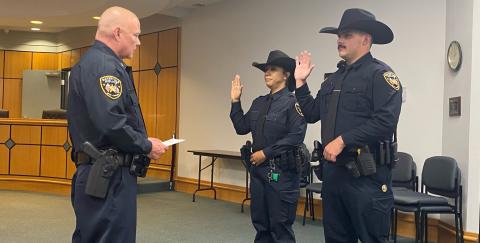 Gatesville Police Chief Jeffrey Clark swears in new officers Whitney Myers and William Massey. Gatesville Messenger/David Scott