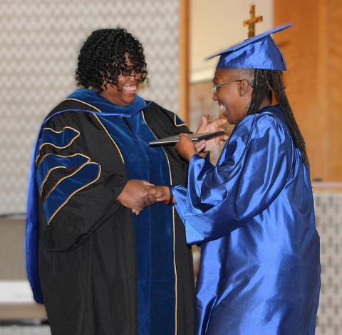 CTC Vice Chancellor of Instruction and Workforce Education Tamara Clunis presents an Associate of Arts degree to Jeremisha Adams at the April commencement ceremony. The college is expanding course offerings to enroll more students thanks to a $750,000 grant from the Trellis Foundation. COURTESY PHOTO
