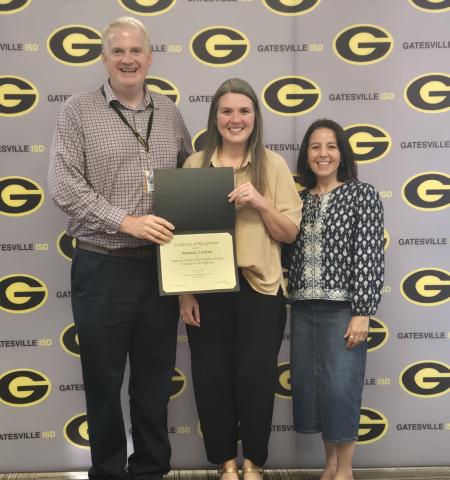 From left to right: GISD Superintendent Dr. Barrett Pollard, staff member Amanda Latham and high school principal Liz Shoaf pose during the Staff Spotlight portion of the Monday, Aug. 17, school board meeting. Ally Hinkle I The Gatesville Messenger