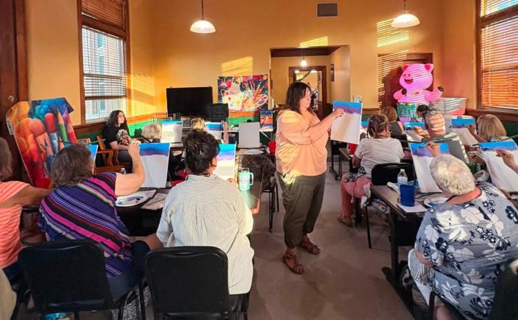 Lynette Sowell-Stevens instructs chamber participants how to create and paint pictures. Courtesy Photo