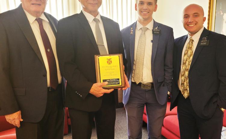 Courtesy photo John Flournoy, Pastor of the Church of Latter-Day Saints in Gatesville, shows off his Military Order of World Wars Plaque with Wendell Jones (left) and the local LDS Missionaries (right). Fluornoy received the award from Retired LTC James Marques from NFH Chapter. The award is given to those in the community who have done outstanding service to the people of Gatesville.
