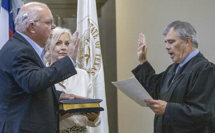 Rob Erwin takes his oath of office for interim County Judge, administred by Judge Trent Farrell on Tuesday afternoon at the Coryell County Commmissiners Courtroom in Gatesville. He replaced Roger Miller, who resigned Sept. 14. Gatesville Messenger | Ally Hinkle