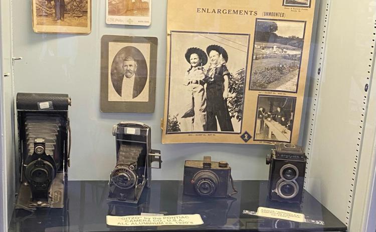 Display cases that show early day cameras and photographs from Coryell County.