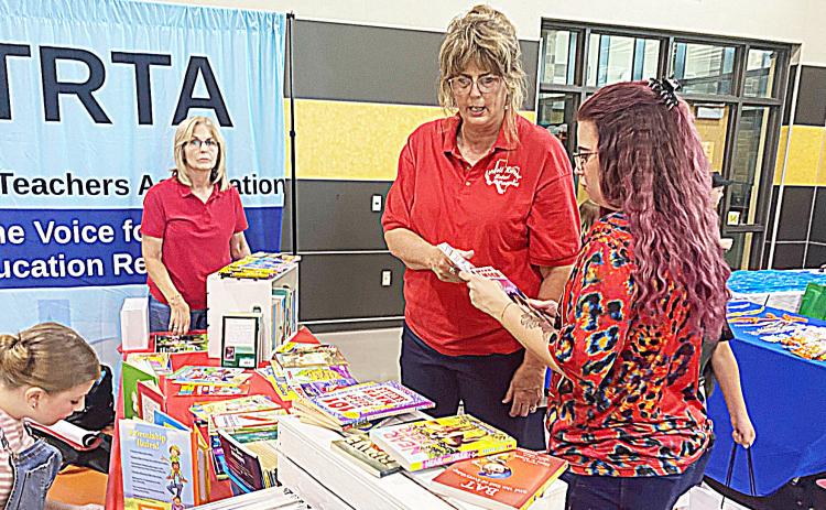 Members of the Retired Teachers Association had a booth at the recent Back to School Bash where they handed out free books to students and parents. They had several students interested in the books they were providing. The Gatesville Messenger/ David Scott