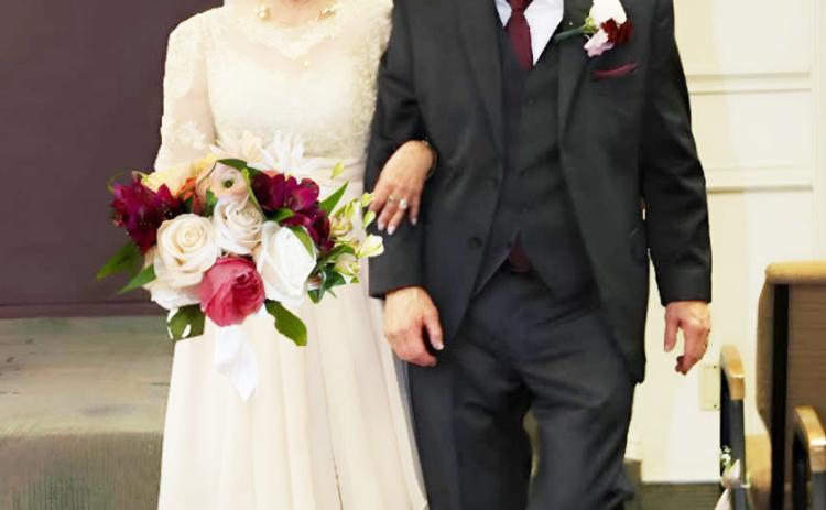 Gloria Veazey and Bruce Waite walk arm-in-arm down the aisle. Courtesy photo