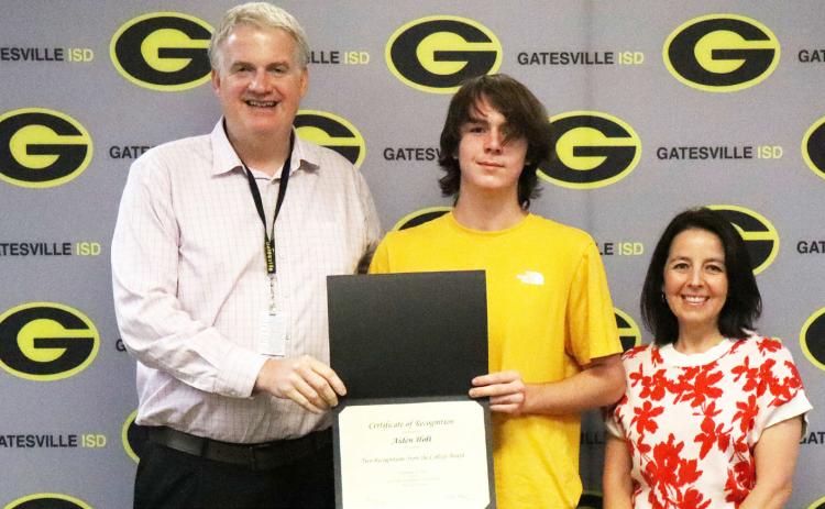 From left to right GISD Superintendent Dr. Barrett Pollard, GHS senior Aiden Holt and GHS principal Liz Shoaf pose as Holt is recognized during the Student Spotlight portion of the Sept. 21 school board meeting. Gatesville Messenger | Ally Hinkle